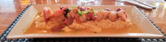 A plate of shrimp and grits