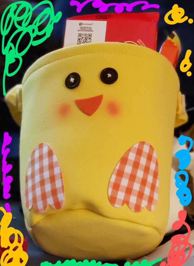 Yellow fabric basket decorated to look like a chick
