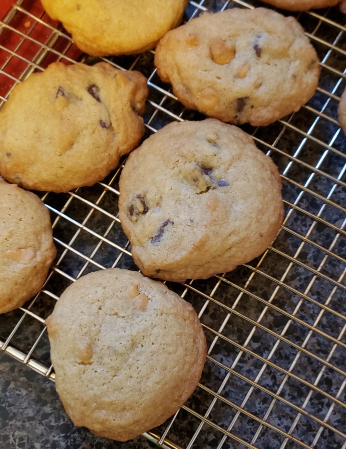 Chocolate chip/butterscotch cookies on a cooling rack.