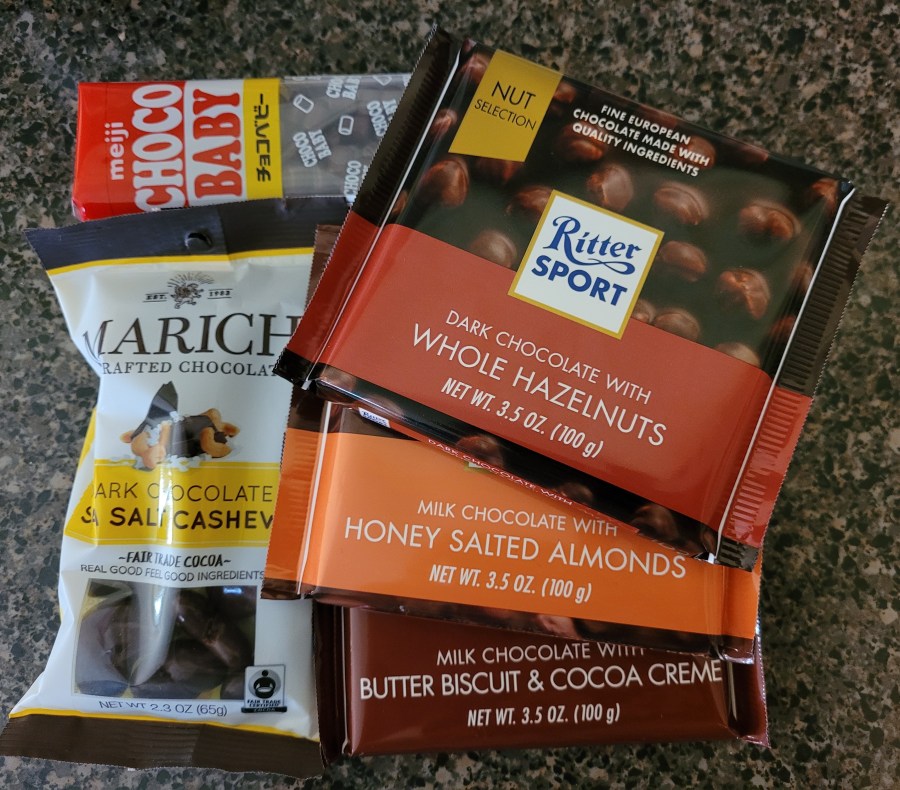 Choco baby candies, chocolate covered cashews, and Ritter Sport chocolate bars