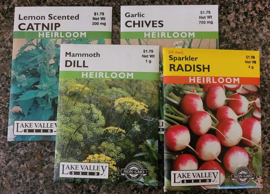 Seed packets for Catnip, Dill, Chives, and Radishes