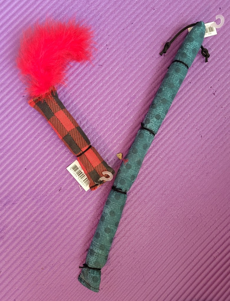 Two fabric tube-shaped kitty toys