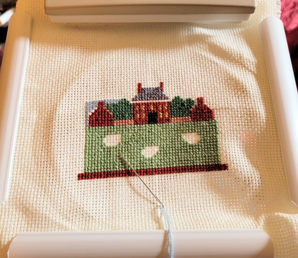 Cross stitch project of the Governors Mansion in Williamsburg Virginia