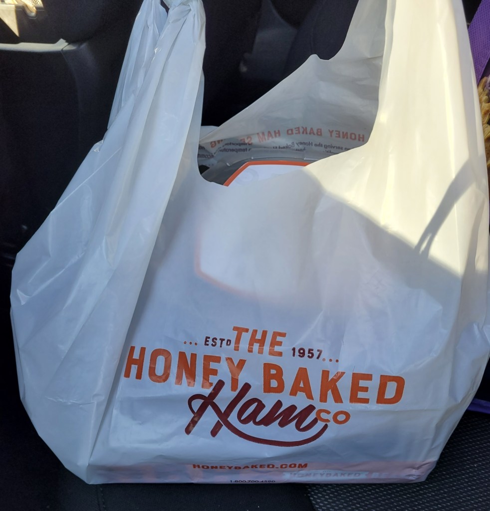 A bag from the Honey Baked Ham store.