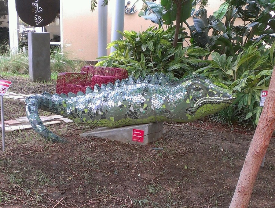 Iguana scupture made of mirrored pieces at the Aruba airport