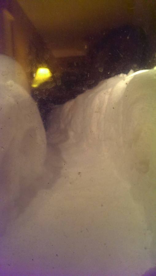 A path dug through a blizzard, about 4 feet high on either side