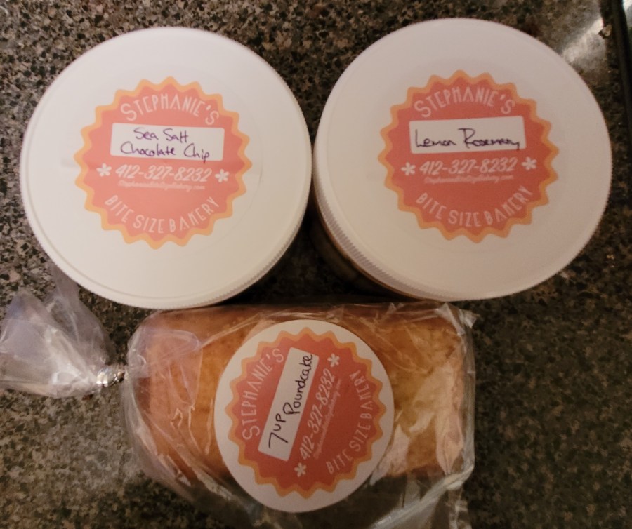 Two containers of shortbread, Lemon Rosemary and Sea Salt Chocolate Chip, and a little 7UP pound cake