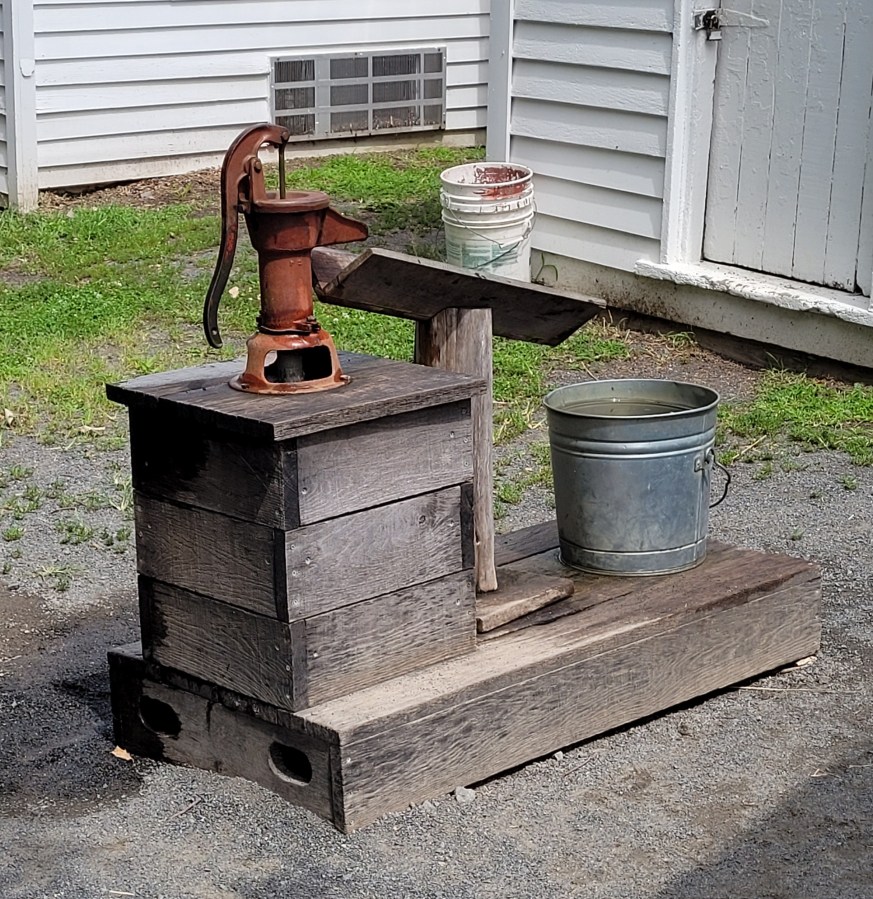 A water well with a hand pump that still works