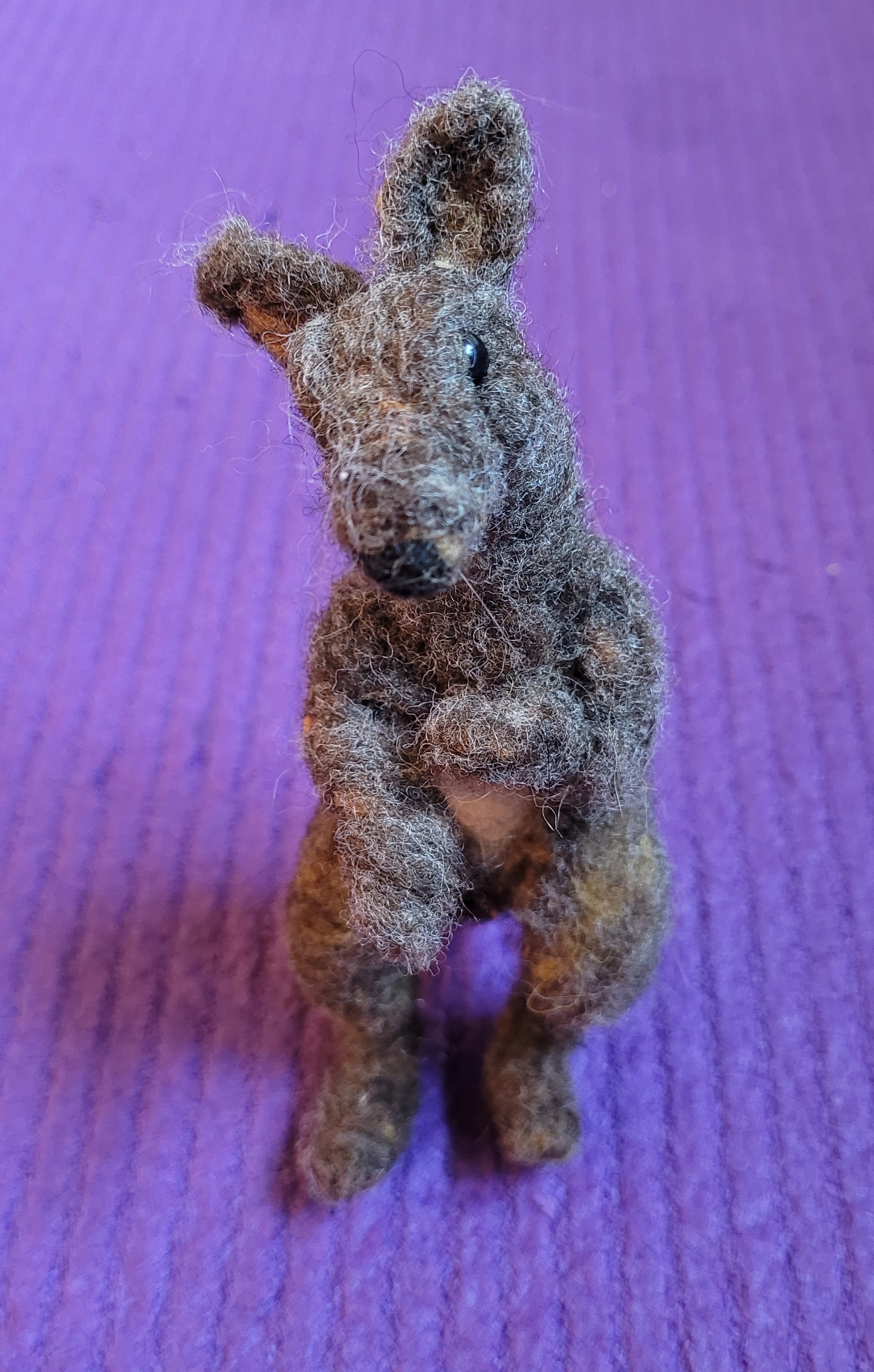 A needle felted brown kangaroo