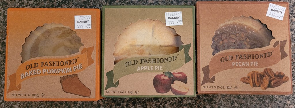 Three tiny pie boxes - pumpkin, apple, and pecan