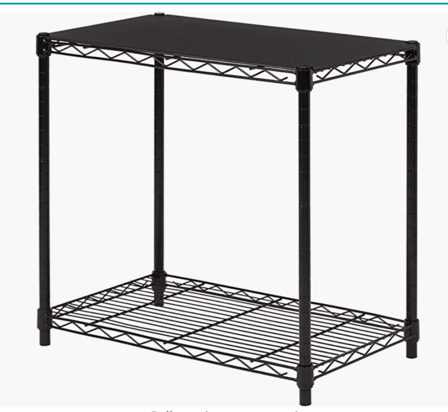 A two tiered black metal shelving unit