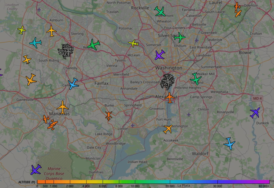 Screenshot of the ADS-B Exchange website, showing all the aircraft in my area. There are two clusters of grey airplane icons, those are our airports